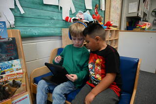 Students sharing tablet