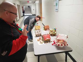Judges analyze the gingerbread architecture
