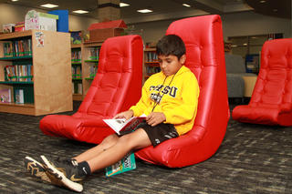 Student reads in Media Center 